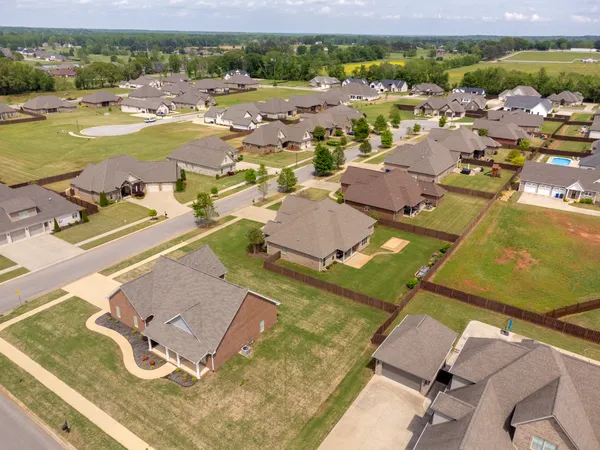 an aerial view of residential houses with outdoor space