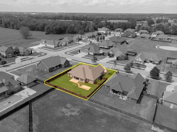 a view of a swimming pool with lawn chairs