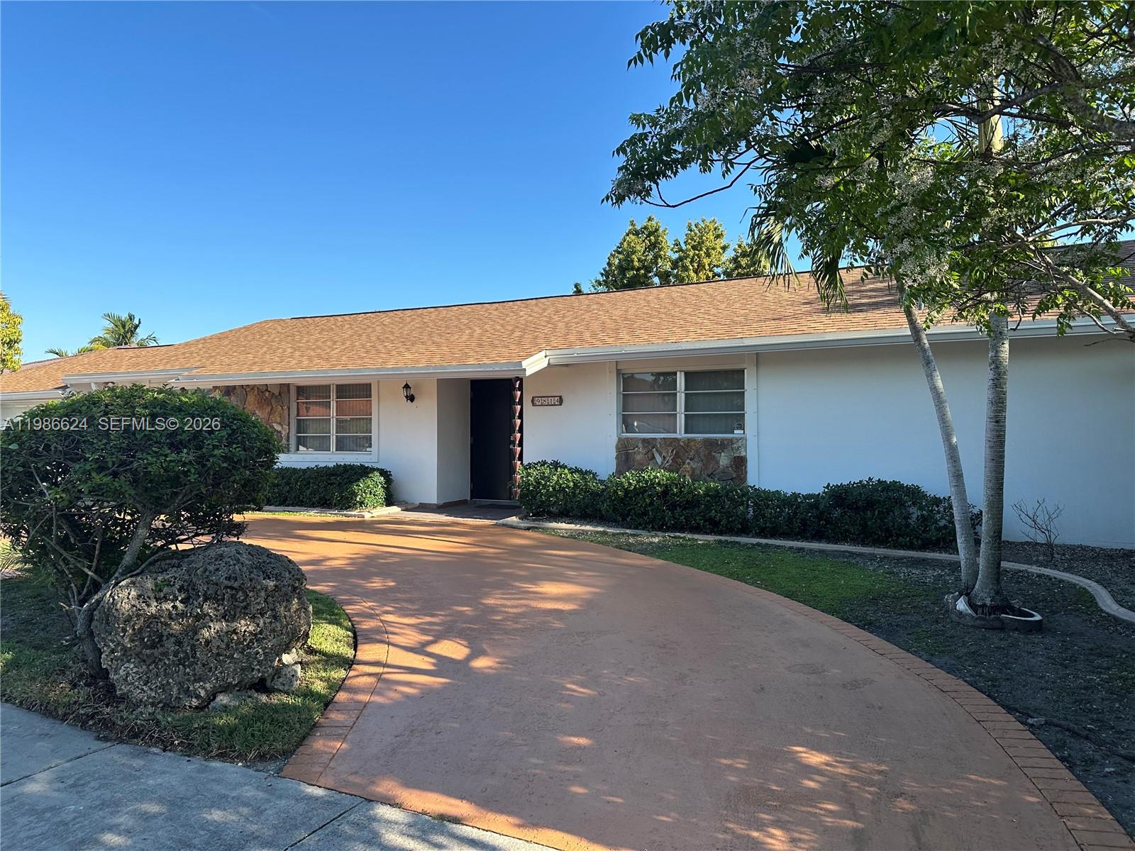 9814 Southwest 4th Terrace Miami, FL 33174 - Photo 2 of 10 a front view of a house with yard