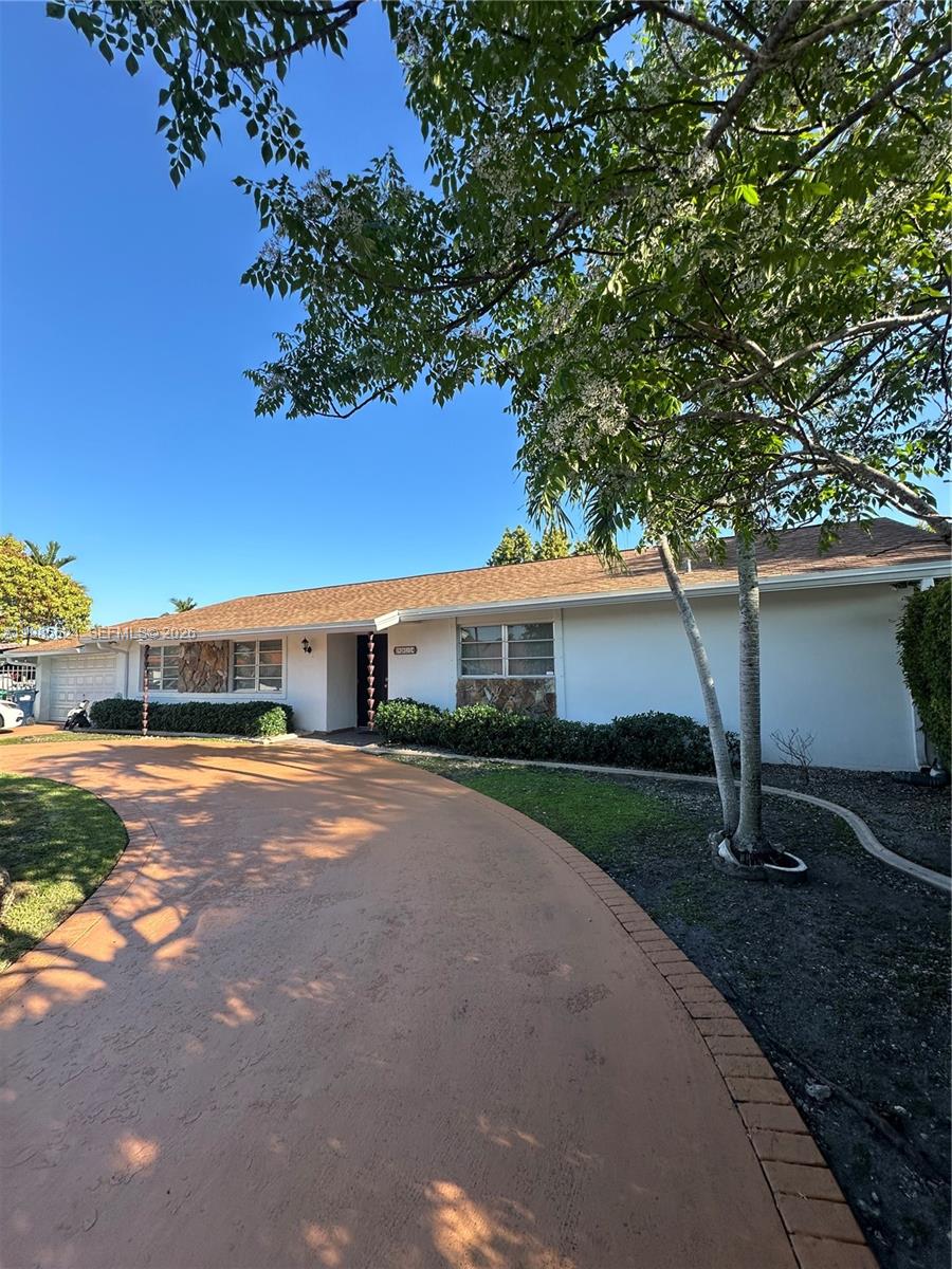 9814 Southwest 4th Terrace Miami, FL 33174 - Photo 3 of 10 a front view of a house with yard and parking