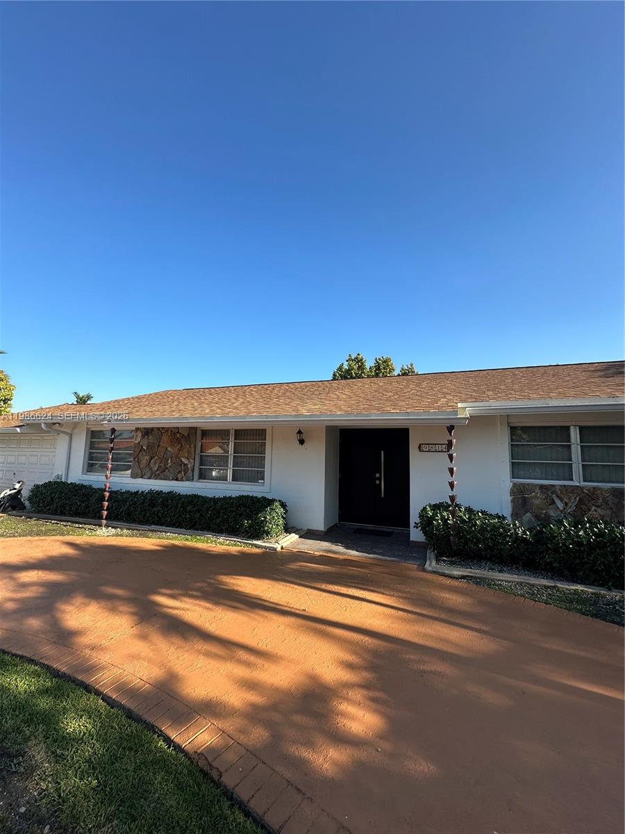 9814 Southwest 4th Terrace Miami, FL 33174 - Photo 4 of 10 a view of a house with swimming pool and yard