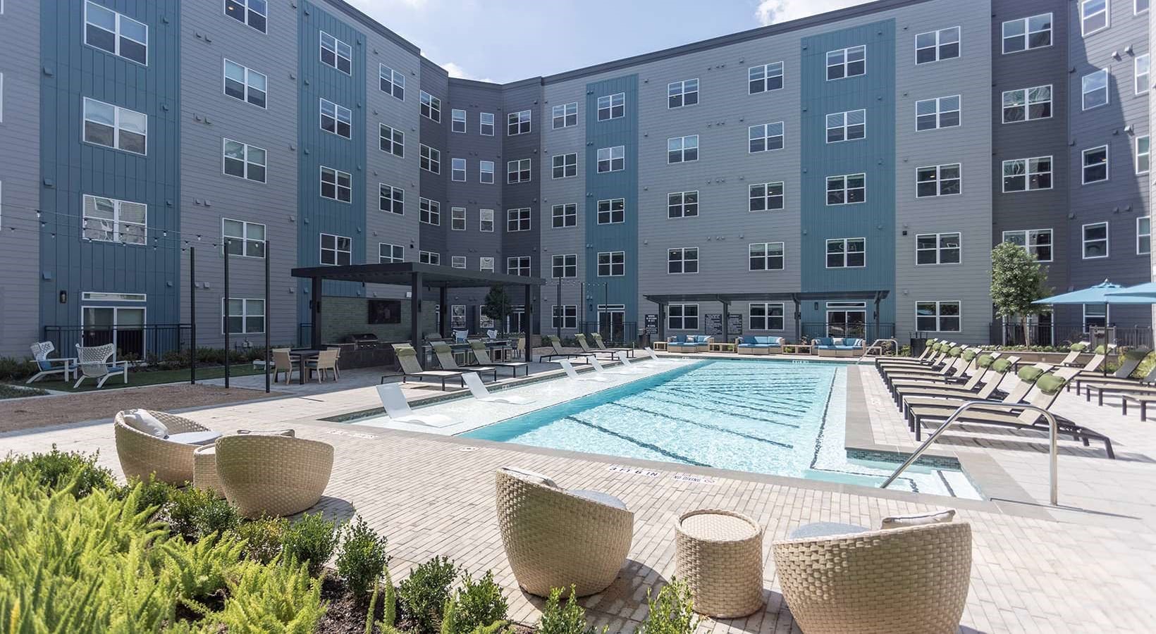 2425 Bell Street, Unit 2145 Houston, TX 77003 - Photo 13 of 30 a view of a patio with couches and table and chairs