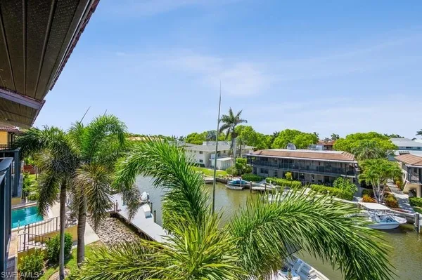 a backyard of a house with lots of green space and plants