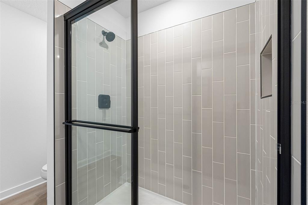 5466 Parnell Avenue Spring Hill, FL 34608 - Photo 7 of 7 a bathroom with a shower