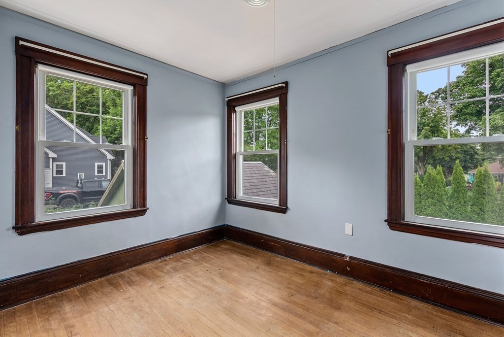 7 Pleasant Street Wellesley, MA 02482 - Photo 14 of 23 a view of an empty room with a window
