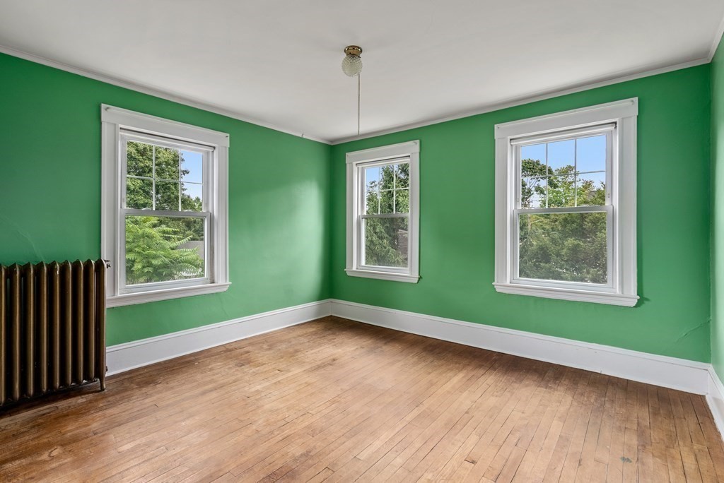 7 Pleasant Street Wellesley, MA 02482 - Photo 15 of 23 a view of room with window and hardwood