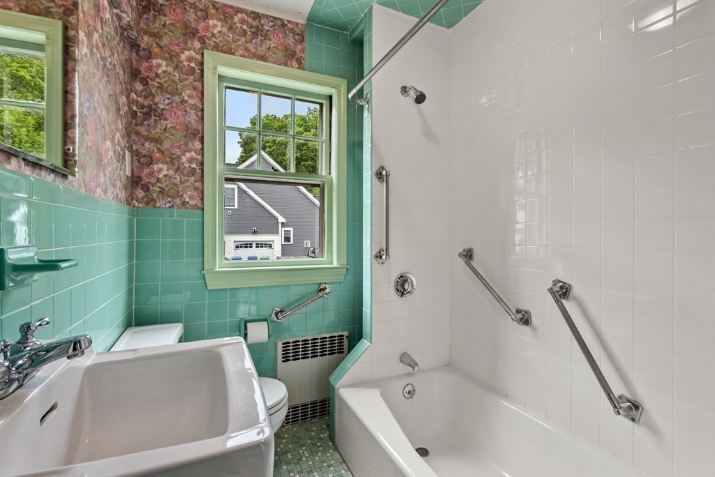 7 Pleasant Street Wellesley, MA 02482 - Photo 16 of 23 a bathroom with a bathtub sink and toilet