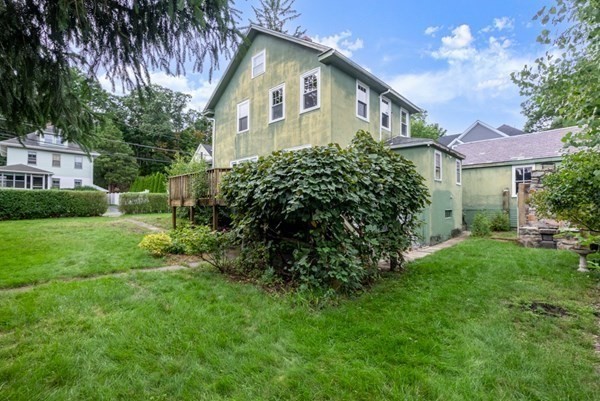 7 Pleasant Street Wellesley, MA 02482 - Photo 18 of 23 a front view of a house with a yard