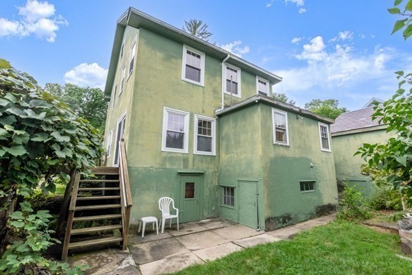 7 Pleasant Street Wellesley, MA 02482 - Photo 20 of 23 a front view of a house with garden