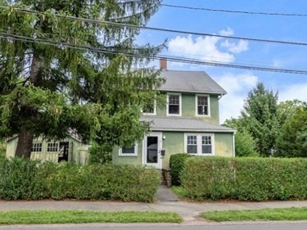7 Pleasant Street Wellesley, MA 02482 - Photo 2 of 23 a front view of a house with a yard