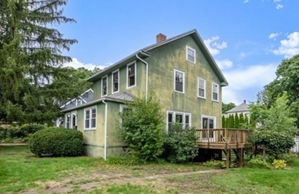 7 Pleasant Street Wellesley, MA 02482 - Photo 23 of 23 a front view of a house with a yard