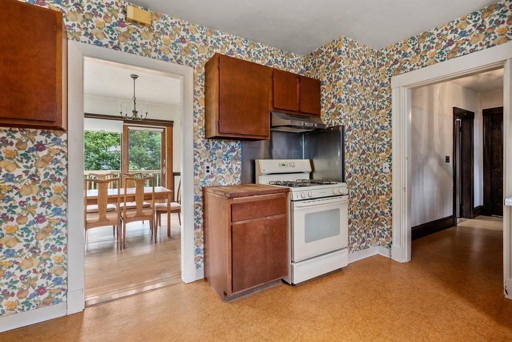 7 Pleasant Street Wellesley, MA 02482 - Photo 5 of 23 a kitchen with stainless steel appliances granite countertop a stove a sink and a microwave
