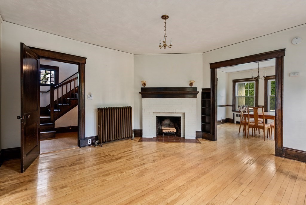 7 Pleasant Street Wellesley, MA 02482 - Photo 8 of 23 a living room with furniture and a fireplace