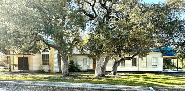 a living room with stainless steel appliances kitchen view and living room view