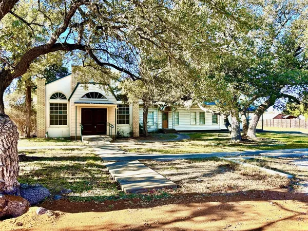 a view of pool with a yard