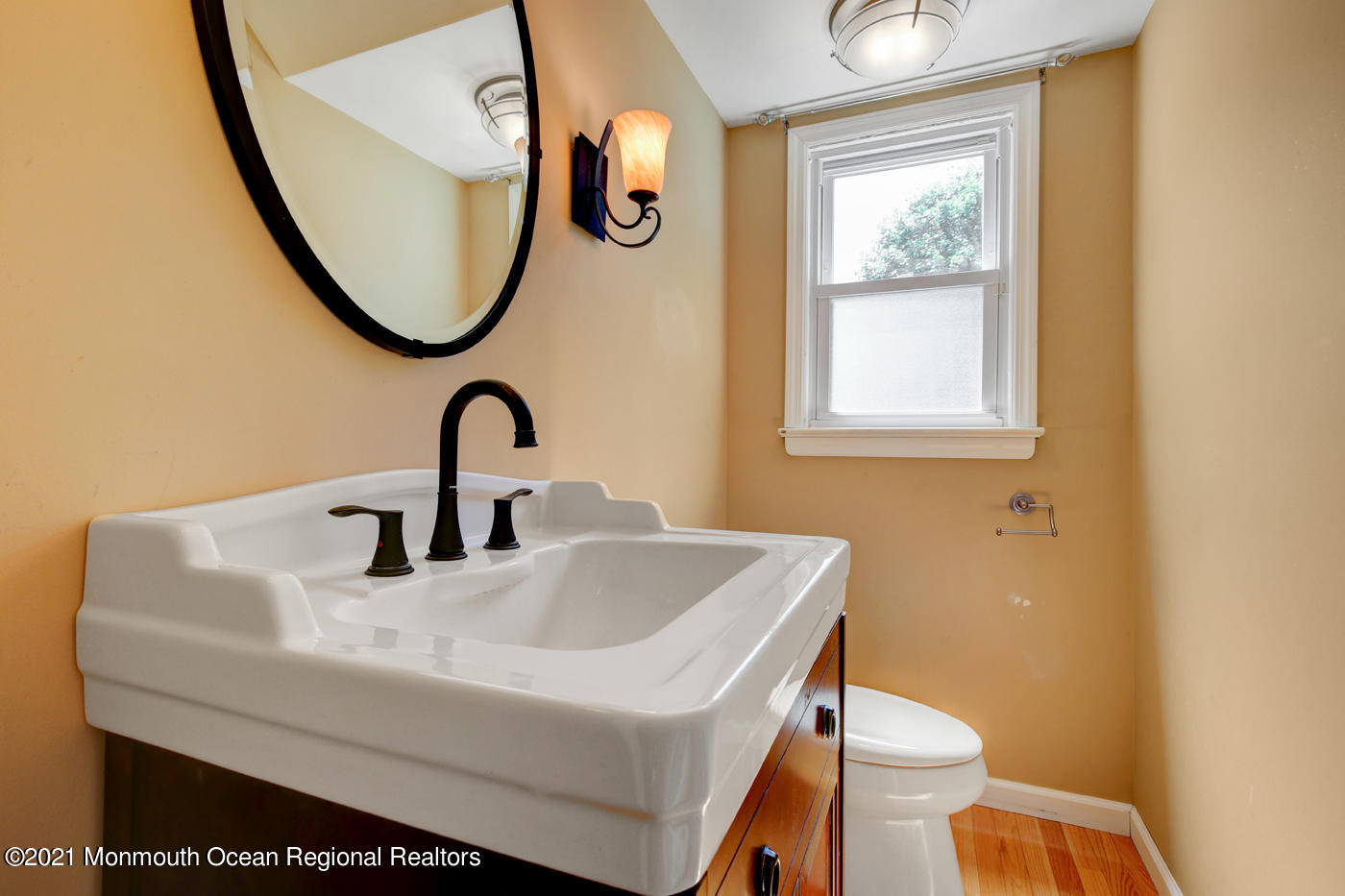 6 Hall Road Freehold, NJ 07728 - Photo 17 of 36 a bathroom with a sink a toilet and a mirror