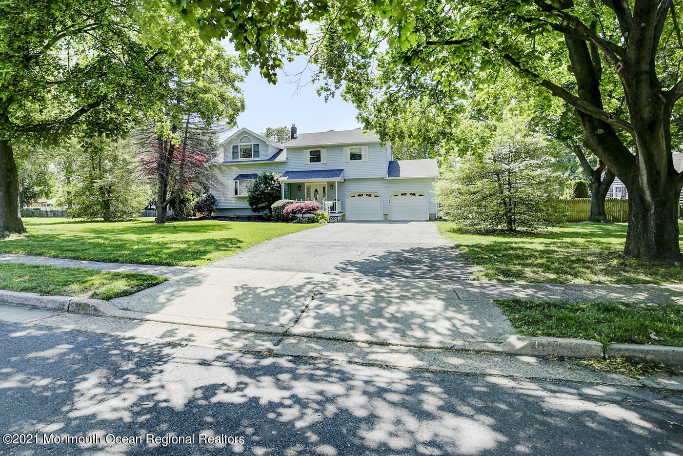 6 Hall Road Freehold, NJ 07728 - Photo 3 of 36 a front view of a house with a yard and garage