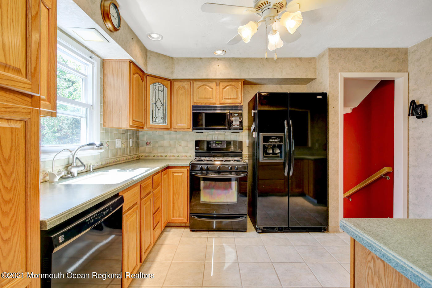 6 Hall Road Freehold, NJ 07728 - Photo 24 of 36 a kitchen with stainless steel appliances granite countertop a stove top oven a sink and a refrigerator
