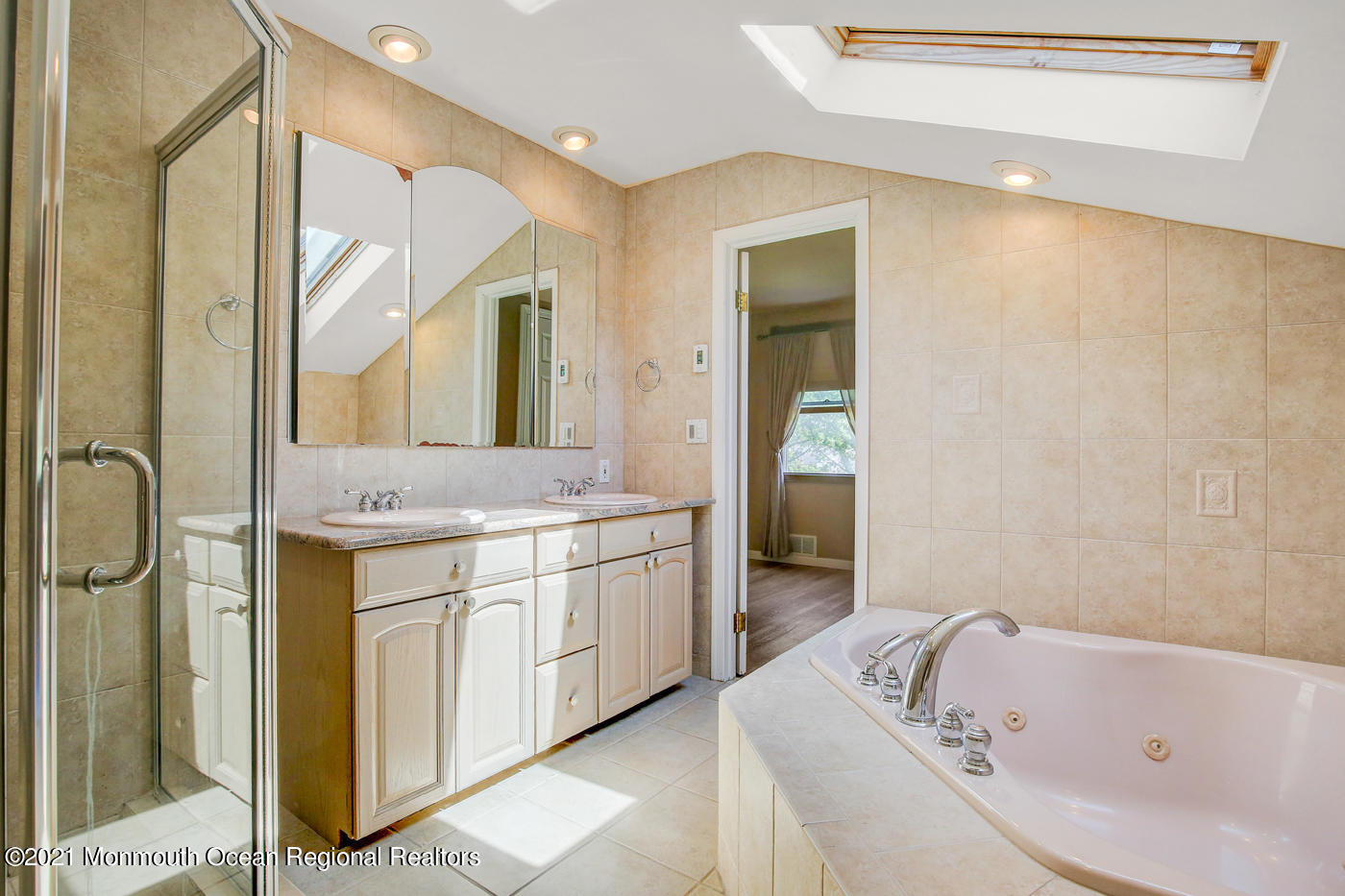 6 Hall Road Freehold, NJ 07728 - Photo 31 of 36 a bathroom with a tub sink and mirror