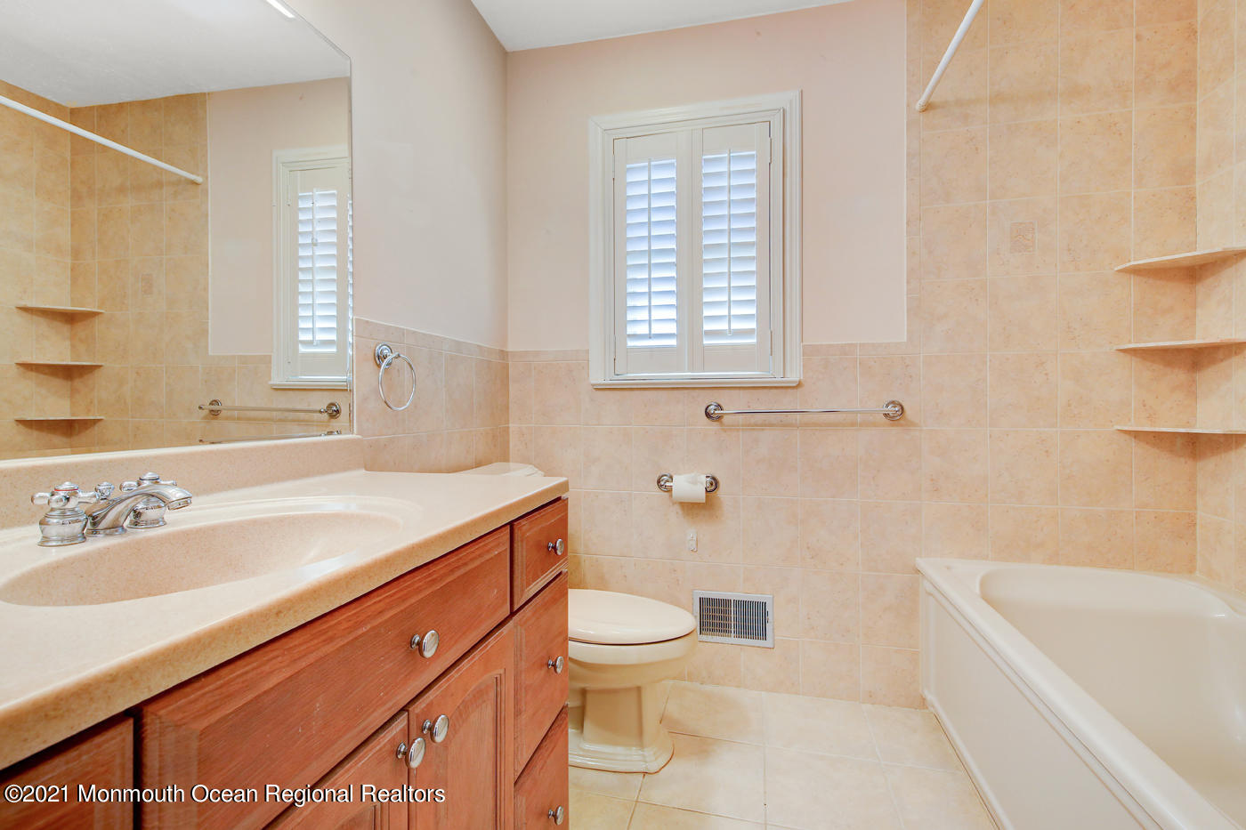 6 Hall Road Freehold, NJ 07728 - Photo 35 of 36 a bathroom with a sink a toilet and bathtub