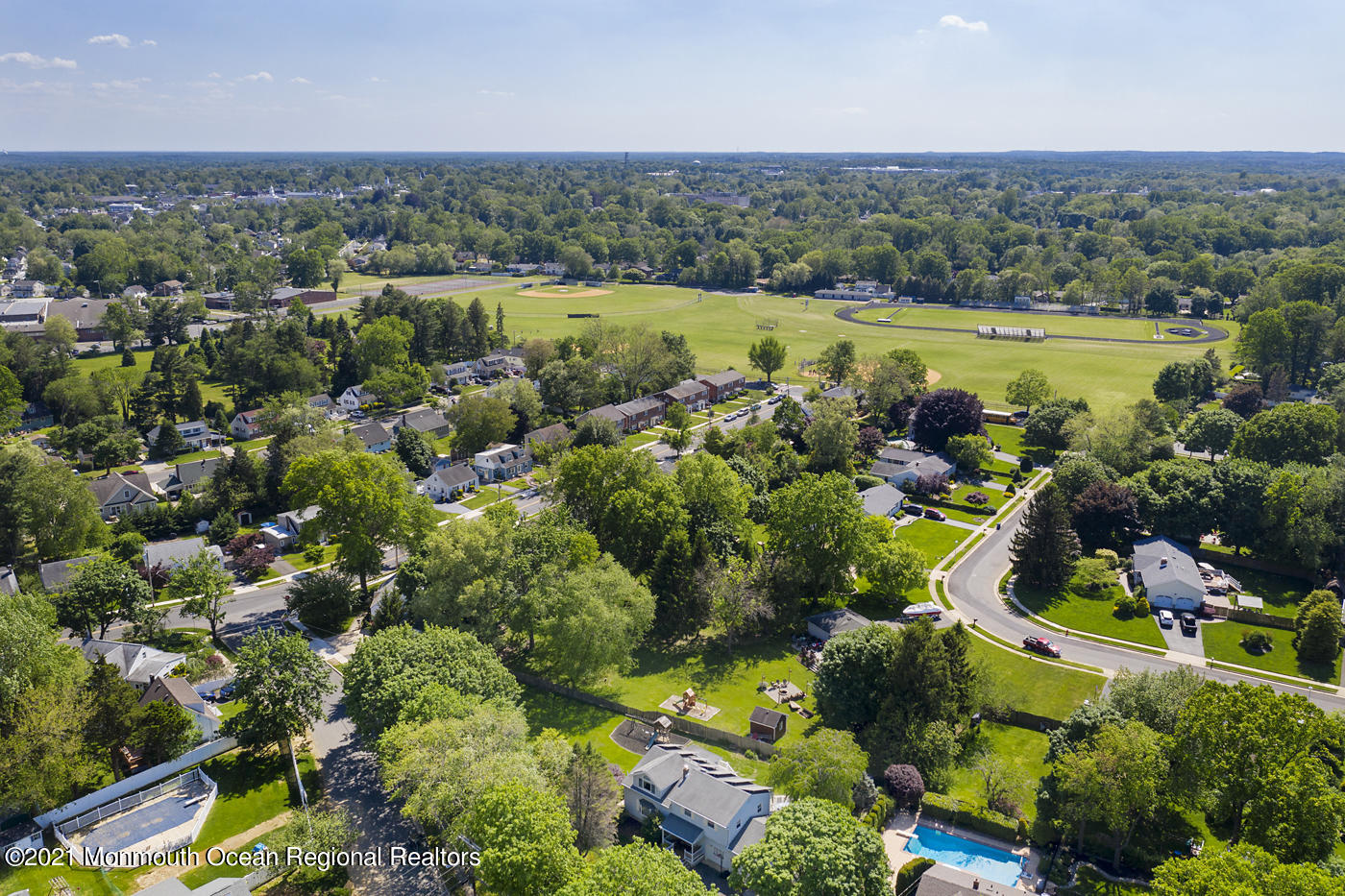 6 Hall Road Freehold, NJ 07728 - Photo 36 of 36 an aerial view of a houses with a yard and lake view