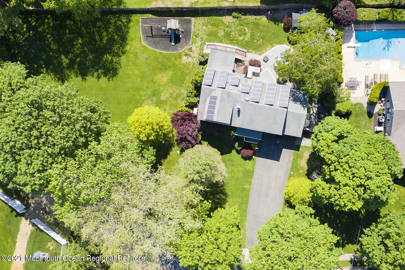 6 Hall Road Freehold, NJ 07728 - Photo 9 of 36 an aerial view of a house with a yard swimming pool outdoor seating and yard
