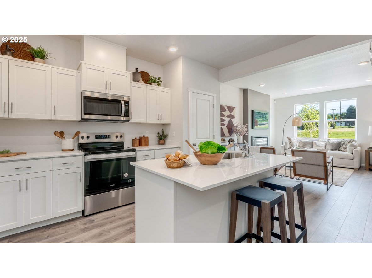3441 Southwest Hartley Avenue Gresham, OR 97080 - Photo 10 of 28 a kitchen with a table and chairs in it