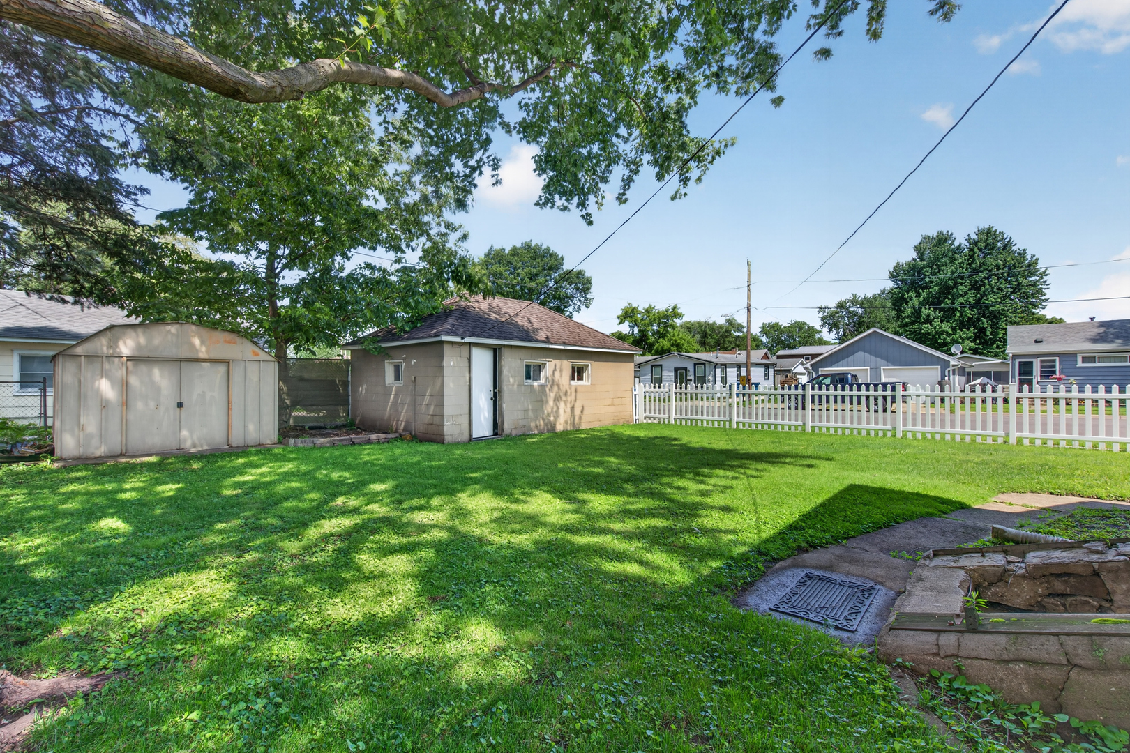 1128 Butler Street Morris, IL 60450 - Photo 28 of 28 a view of a house with backyard and a tree