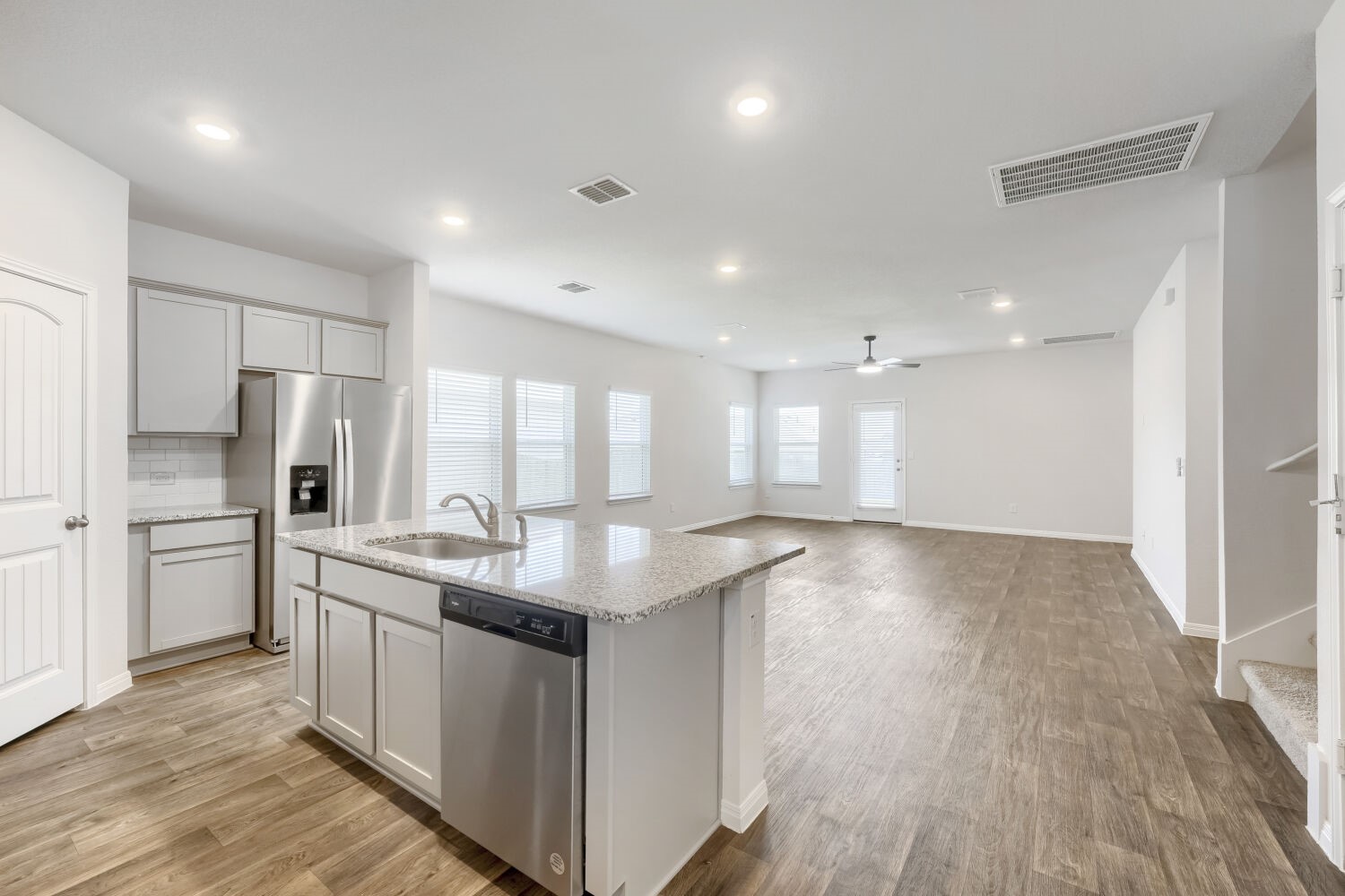 13507 Howser Trace Manor, TX 78653 - Photo 6 of 28 A spacious, open-concept living area with a contemporary kitchen, perfect for entertaining.