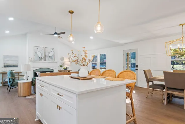 a view of a dining room and hall with furniture