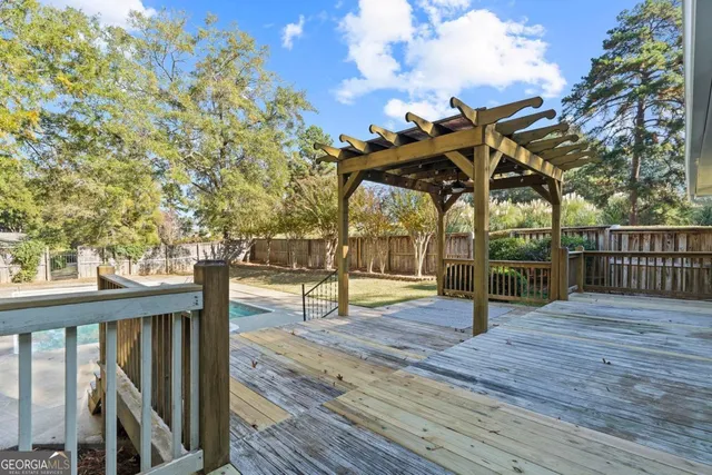 a view of a deck with a backyard