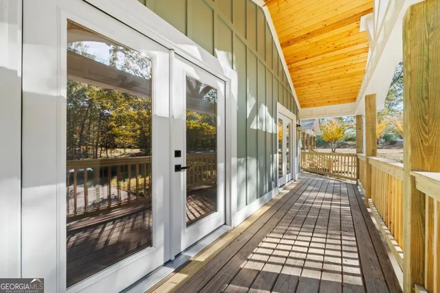 a view of a balcony with wooden floor