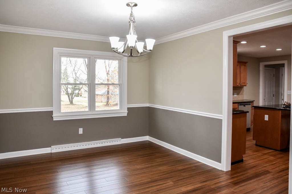 340 Kenridge Road Akron, OH 44333 - Photo 3 of 21 Formal dining room with thick crown molding and wood flooring.