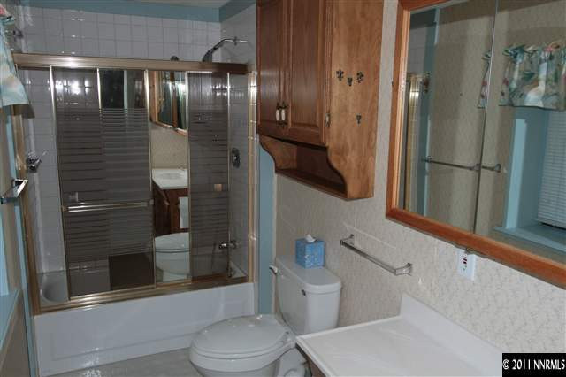 17485 Fantail Street Reno, NV 89508 - Photo 13 of 13 a bathroom with a toilet and a shower