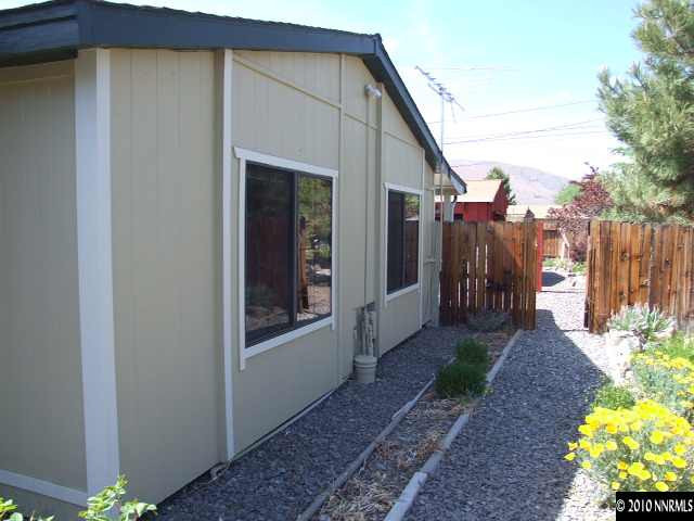 17485 Fantail Street Reno, NV 89508 - Photo 3 of 13 a view of a house with a backyard