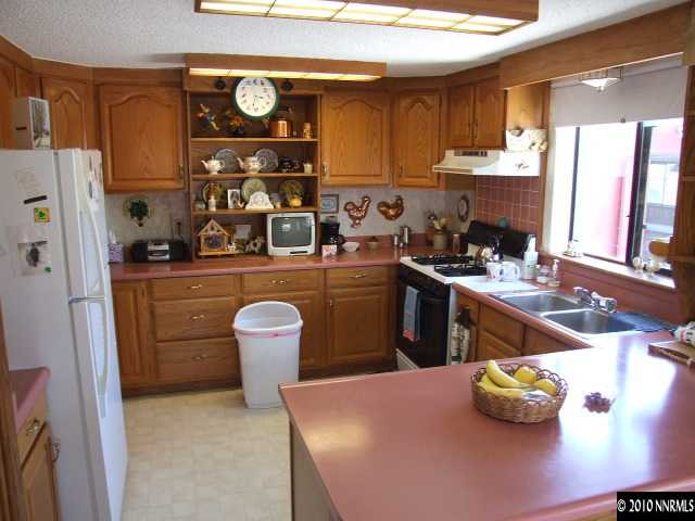 17485 Fantail Street Reno, NV 89508 - Photo 8 of 13 a kitchen with a sink appliances and cabinets