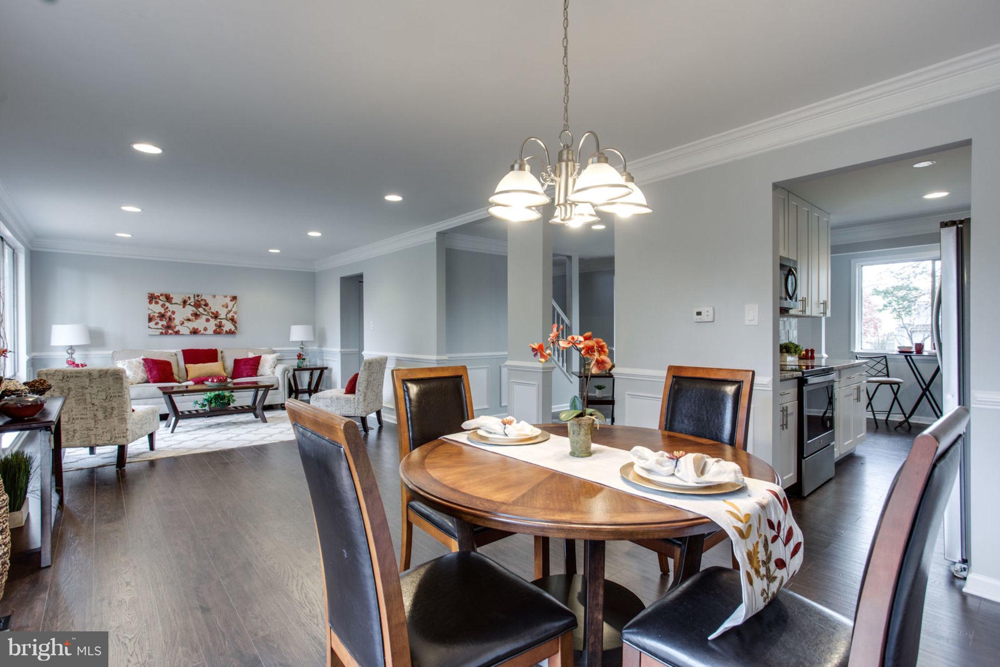 14312 Sturtevant Road Silver Spring, MD 20905 - Photo 14 of 43 a view of a dining room with furniture and wooden floor