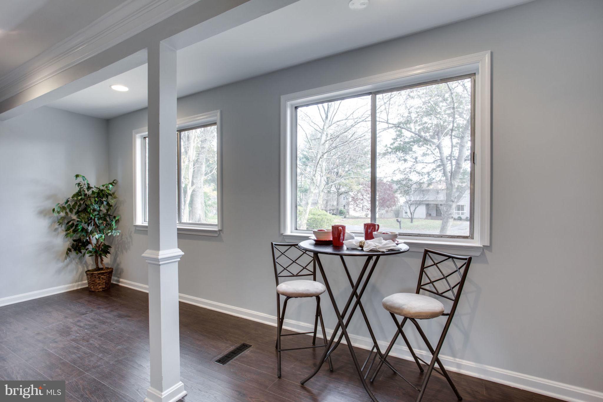 14312 Sturtevant Road Silver Spring, MD 20905 - Photo 17 of 43 a view of a dining room with furniture and a window