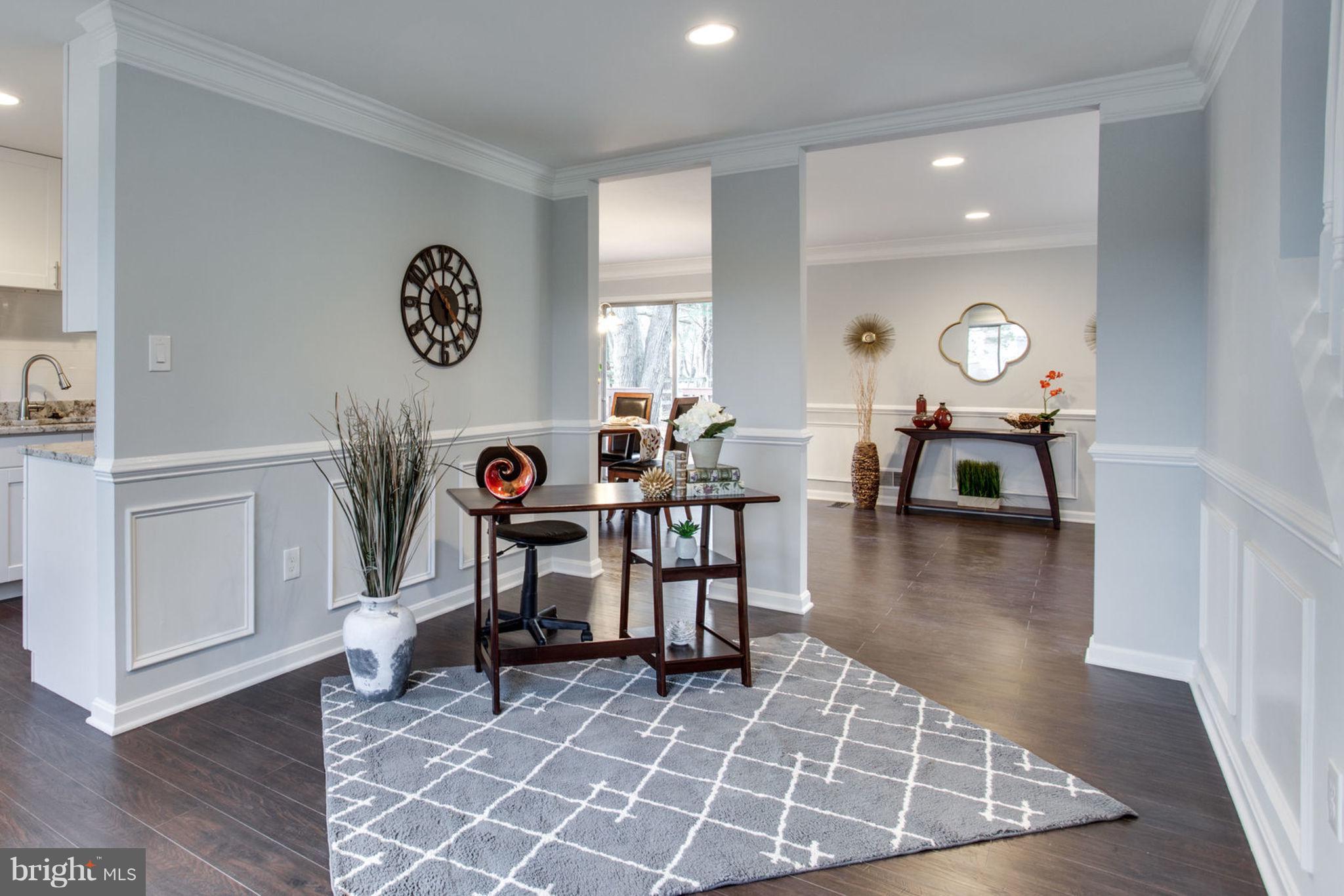 14312 Sturtevant Road Silver Spring, MD 20905 - Photo 4 of 43 a view of a dining room with furniture and wooden floor