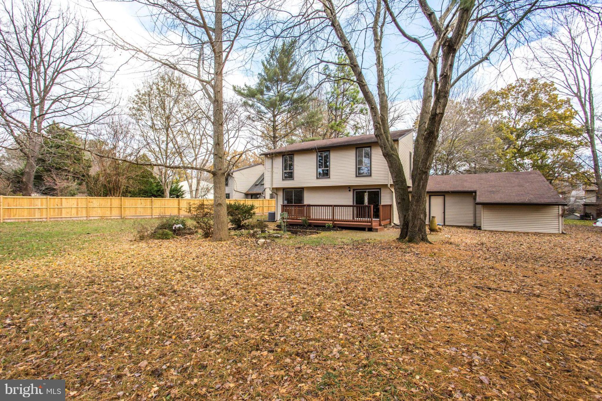 14312 Sturtevant Road Silver Spring, MD 20905 - Photo 39 of 43 a house with trees in front of it