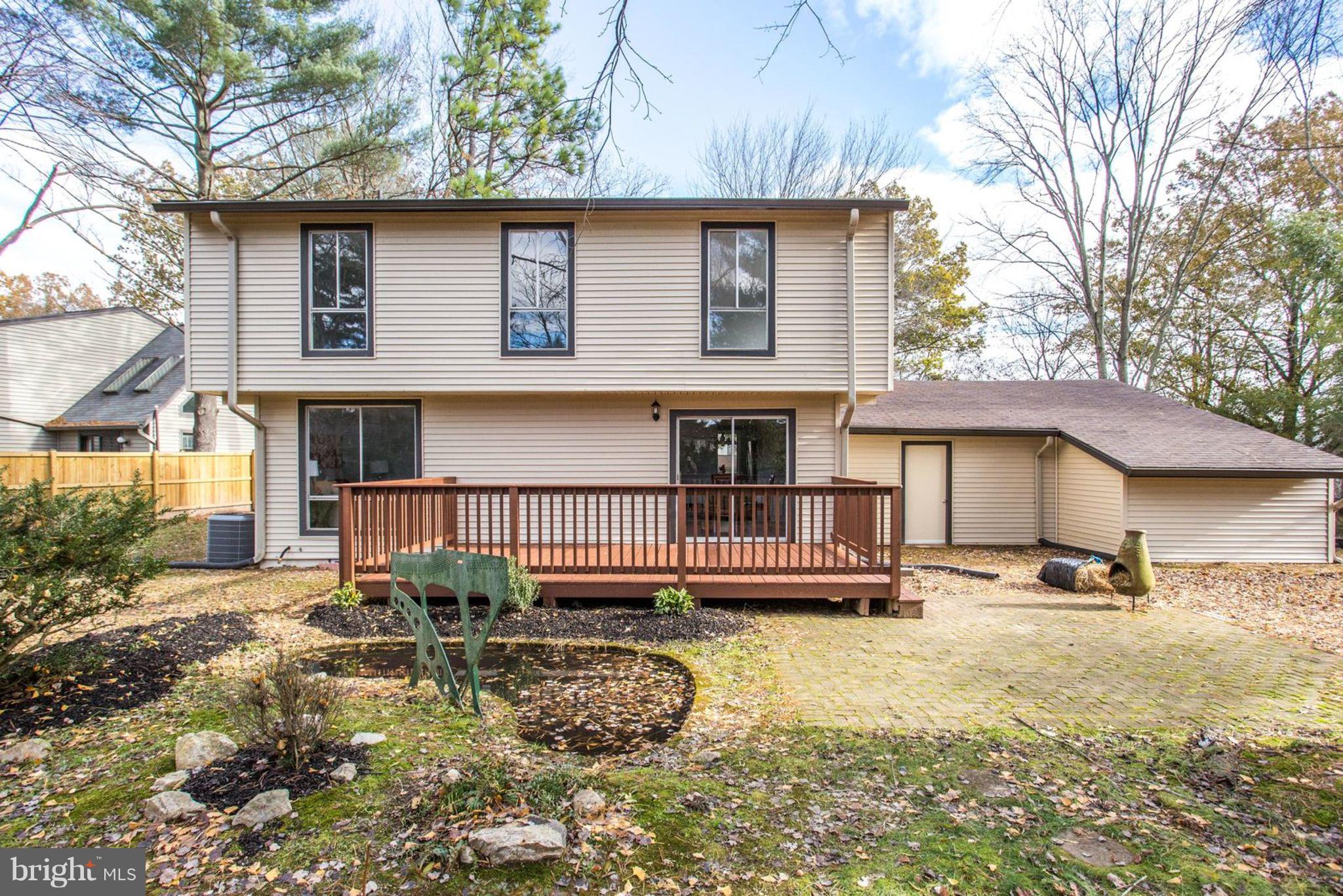 14312 Sturtevant Road Silver Spring, MD 20905 - Photo 40 of 43 a view of a house with a yard and sitting area