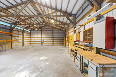 a view of a house with swimming pool and a yard