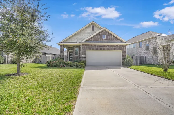 a front view of a house with yard