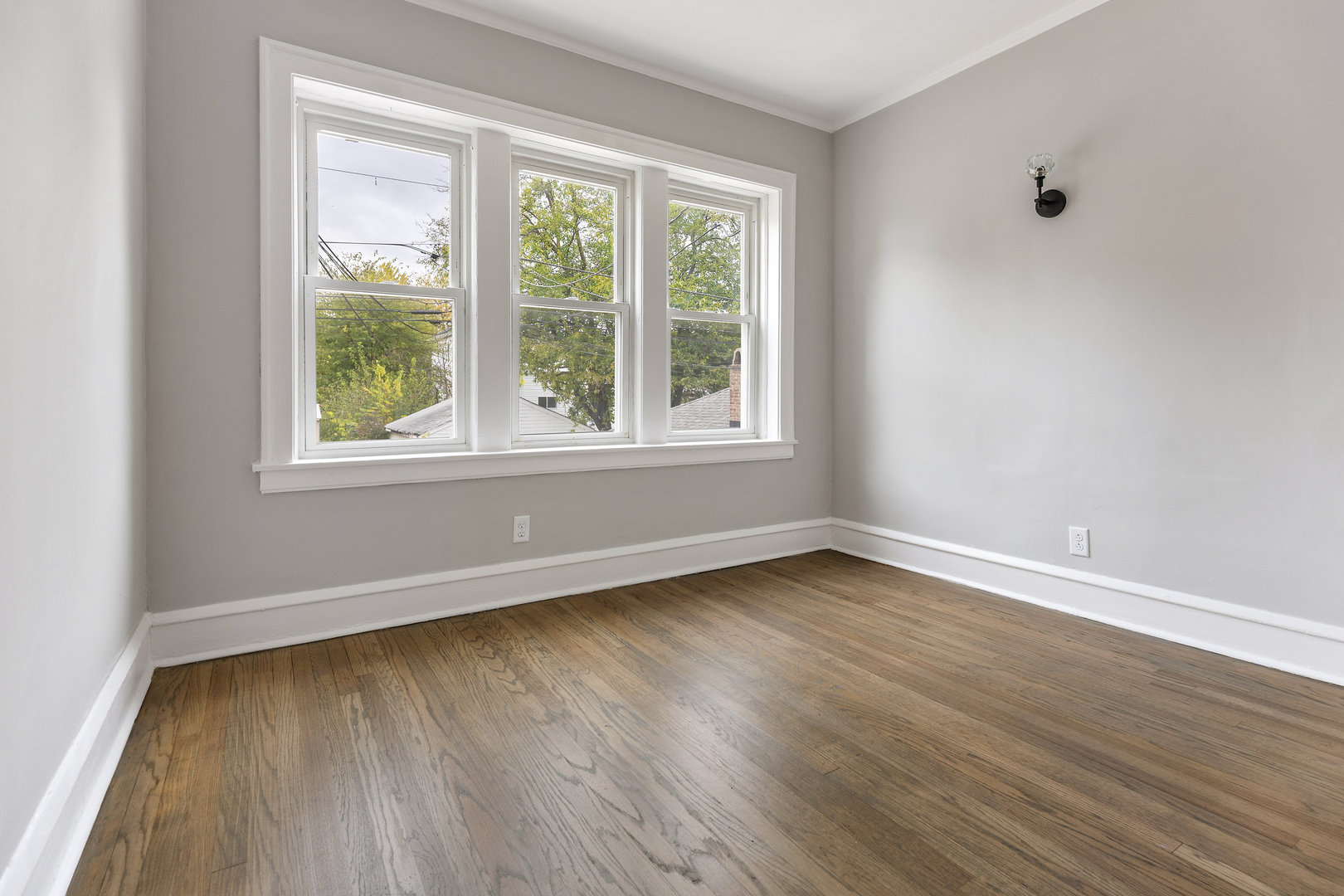 1032 North Austin Boulevard, Unit 1N Oak Park, IL 60302 - Photo 14 of 16 an empty room with wooden floor and windows