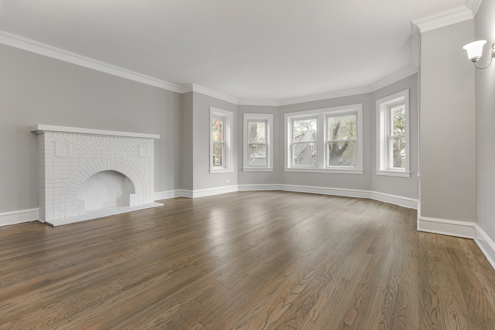 1032 North Austin Boulevard, Unit 1N Oak Park, IL 60302 - Photo 4 of 16 an empty room with wooden floor and windows