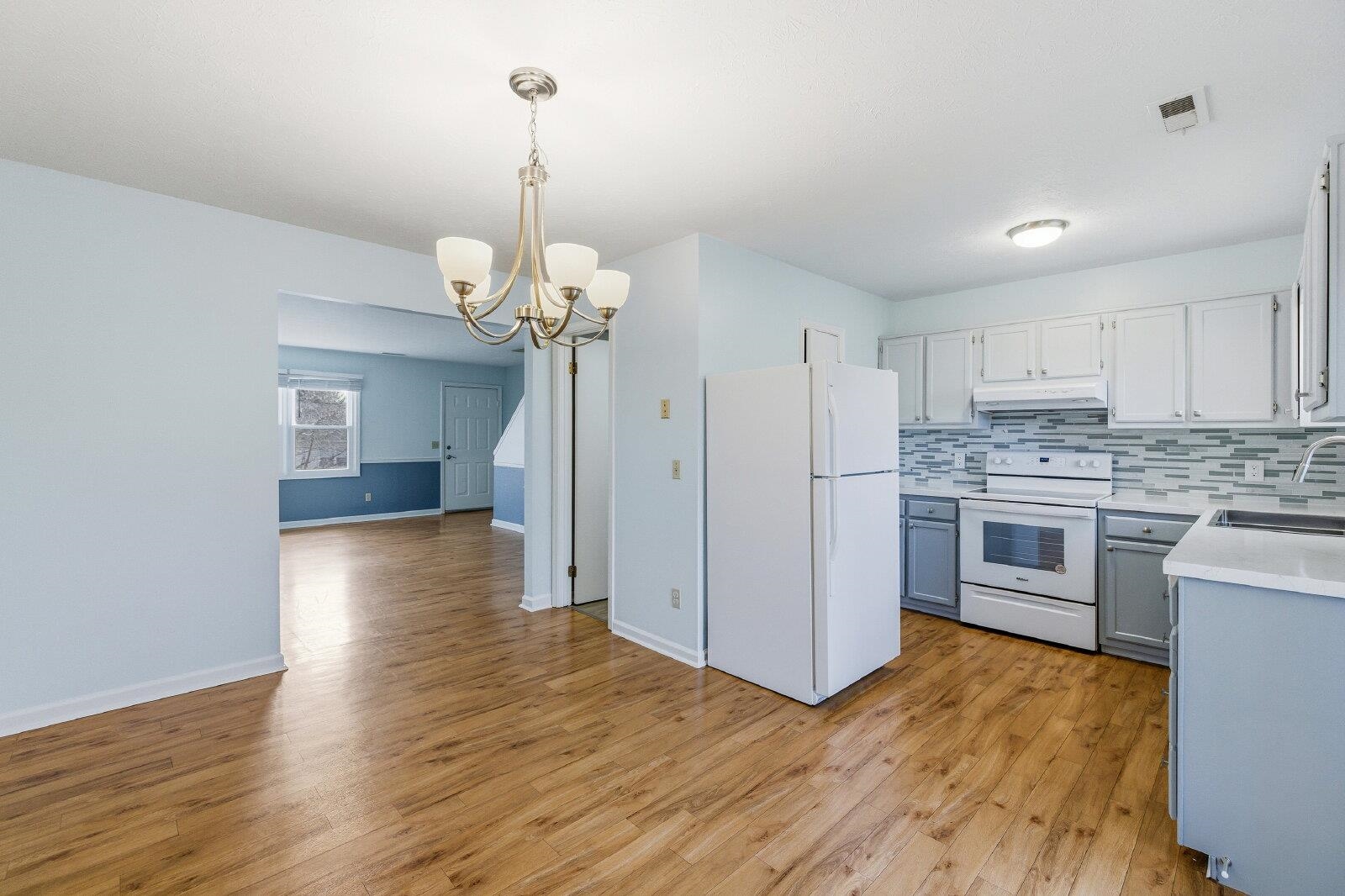 830 Vine Street Harrisonburg, VA 22802 - Photo 11 of 34 a kitchen that has a lot of white cabinets a sink and stainless steel appliances