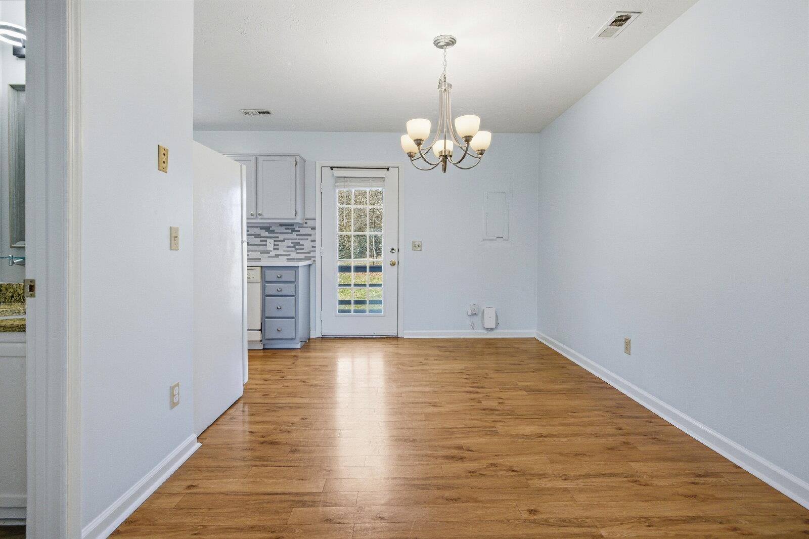 830 Vine Street Harrisonburg, VA 22802 - Photo 13 of 34 wooden floor in an empty room with a window