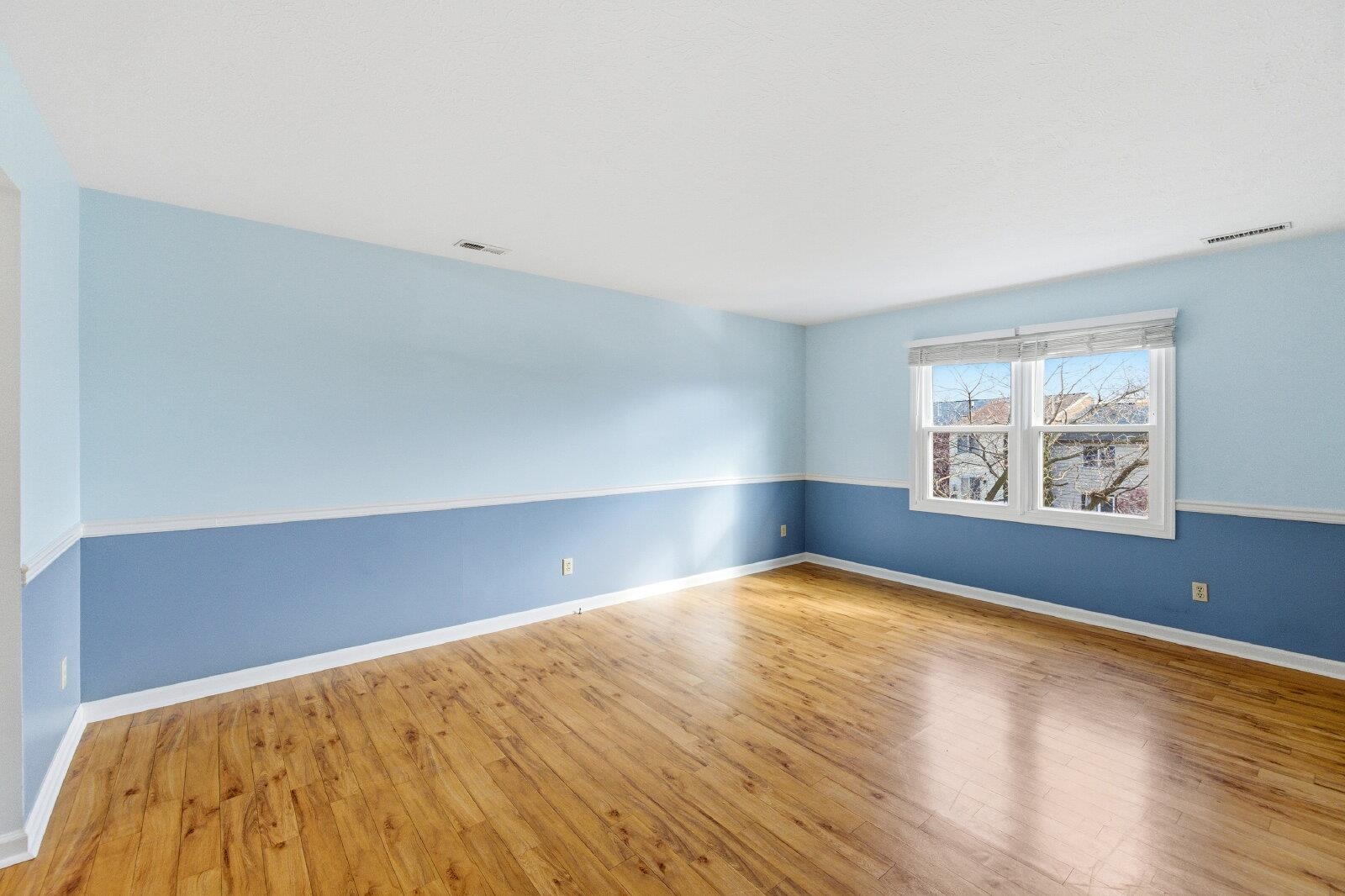 830 Vine Street Harrisonburg, VA 22802 - Photo 15 of 34 an empty room with wooden floor and windows