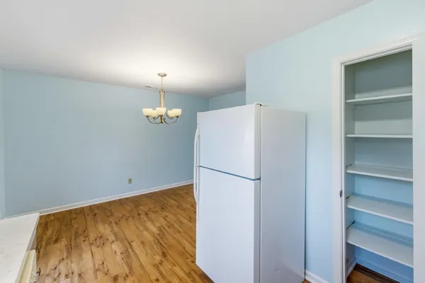 a white refrigerator freezer sitting in a kitchen