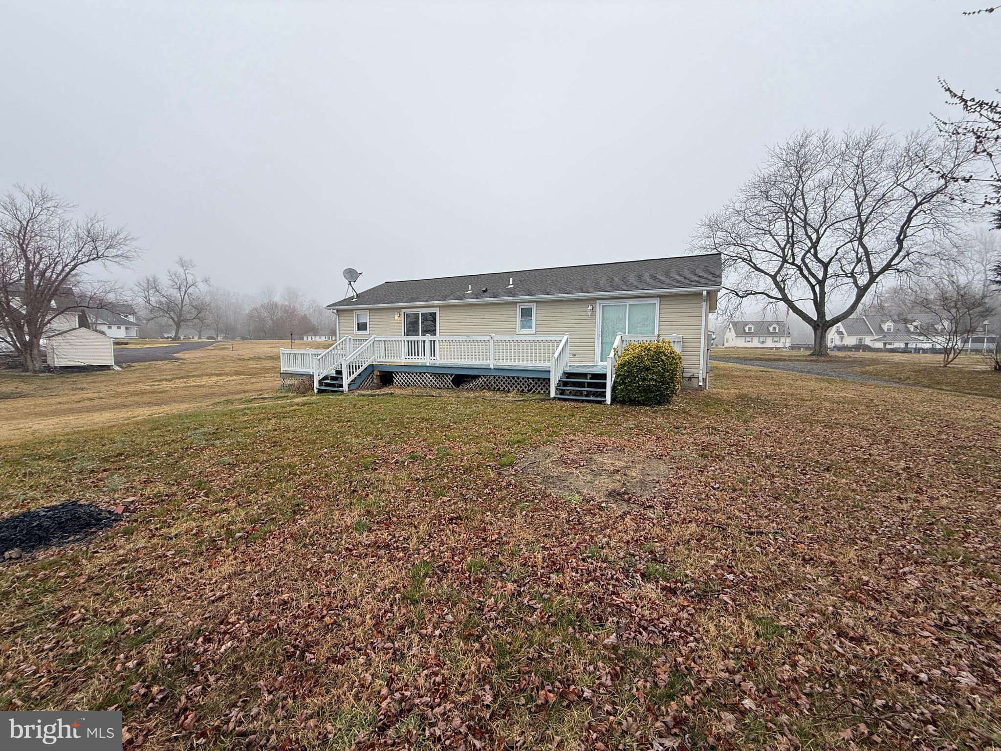 299 Blue Crab Loop Montross, VA 22520 - Photo 3 of 30 a front view of house with yard and ocean